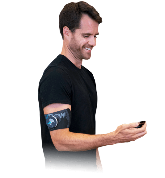 Guy-holding-a-hidow-tens-ems-unit